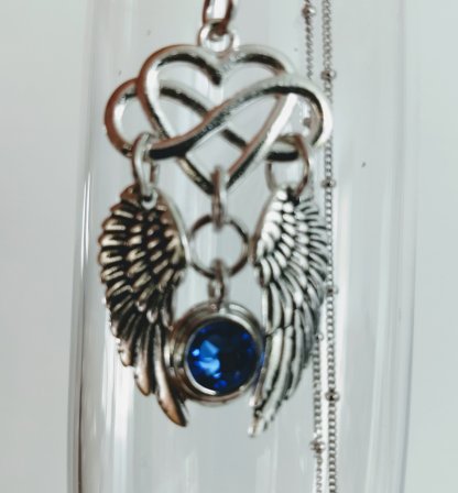 Image of Infinity wings necklace with Sapphire Crystal accent on Sterling silver chain