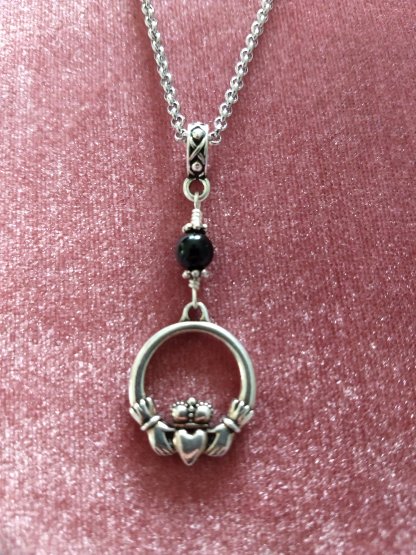 claddaugh and onyx pendant on 22" steel rolo chain