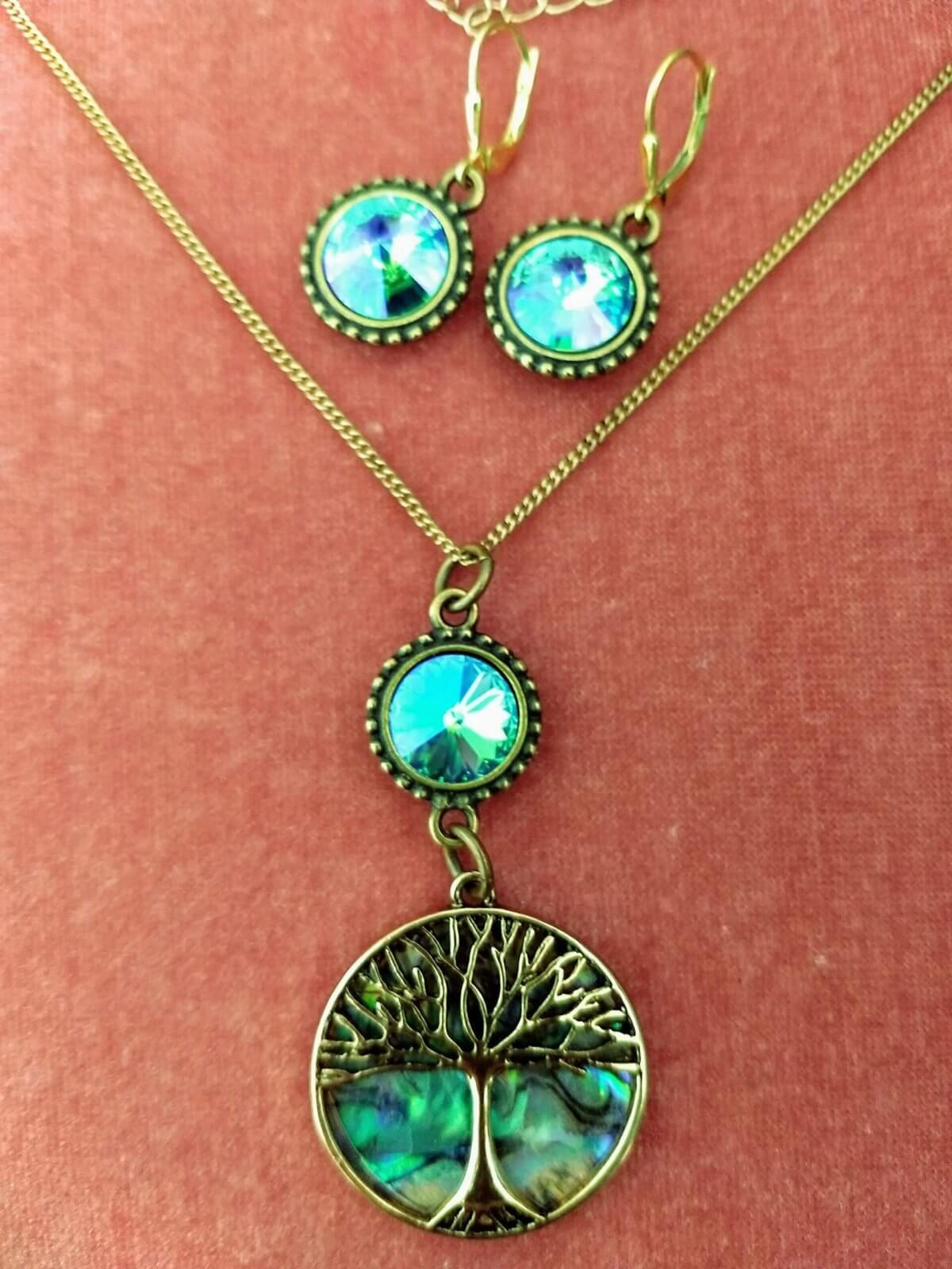 https://lorirae.com/wp-content/uploads/2020/05/Abalone-tree-of-Life-glacier-blue-necklace-gold-oxidized-2-scaled-e1588778257116.jpg